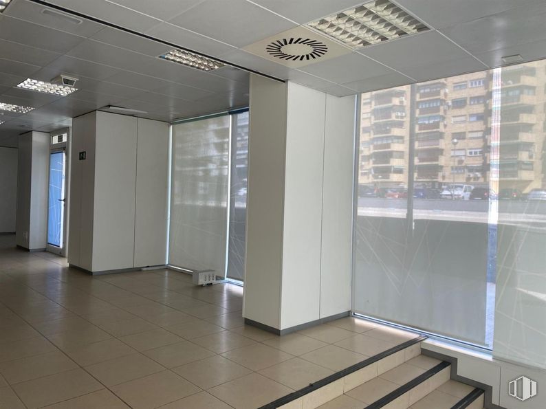 Retail for sale at Avenida Betanzos, Fuencarral - El Pardo, Madrid, 28029 with door, flooring, floor, interior design, ceiling, glass, composite material, commercial building, transparency and shade around