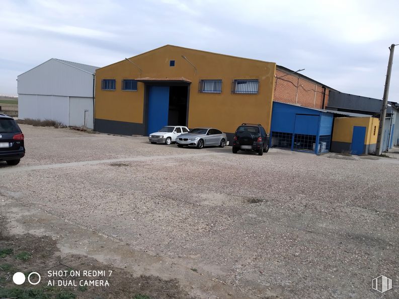 Industrial for rent at Calle Los Sauces, 1, Torrejón de Velasco, Madrid, 28990 with car, building, automotive parking light, sky, land vehicle, cloud, tire, vehicle, wheel and motor vehicle around