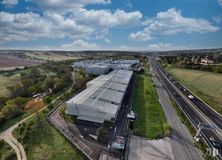 Industrial for sale & for rent at Polígono industrial Sur, San Agustín del Guadalix, Madrid, 28750 with cloud, sky, asphalt, road surface, plant, land lot, urban design, tree, car and thoroughfare around