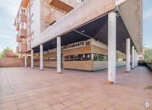 Retail for rent at Calle Costa Verde, Collado Villalba, Madrid, 28400 with building, plant, wood, sky, urban design, road surface, brick, condominium, brickwork and tree around