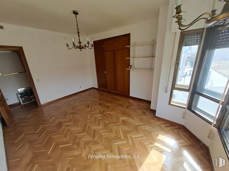 Office for rent at Calle Ferraz, Moncloa - Aravaca, Madrid, 28008 with chandelier, lighting, window, light fixture, property, fixture, door, wood, interior design and floor around