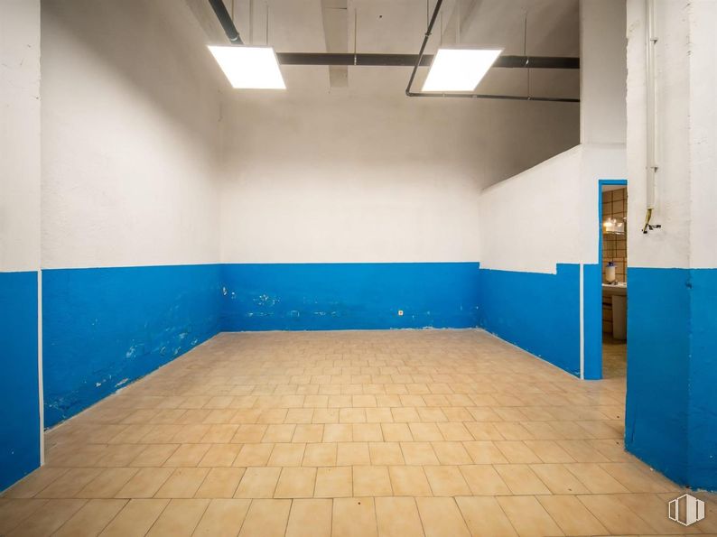 Retail for sale at Calle Mosquilona, Colmenar Viejo, Madrid, 28770 with light fixture, lighting, blue, flooring, wall, floor, composite material, tile, concrete and ceiling around