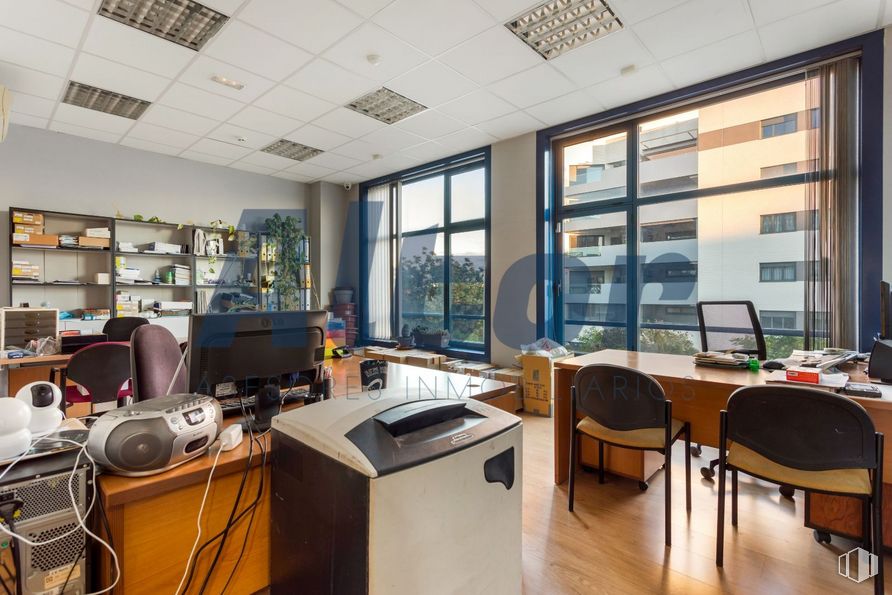 Office for sale at Calle Arroyo Bueno, Villaverde, Madrid, 28021 with chair, desk, window, computer monitor, light fixture, table, building, furniture, property and interior design around