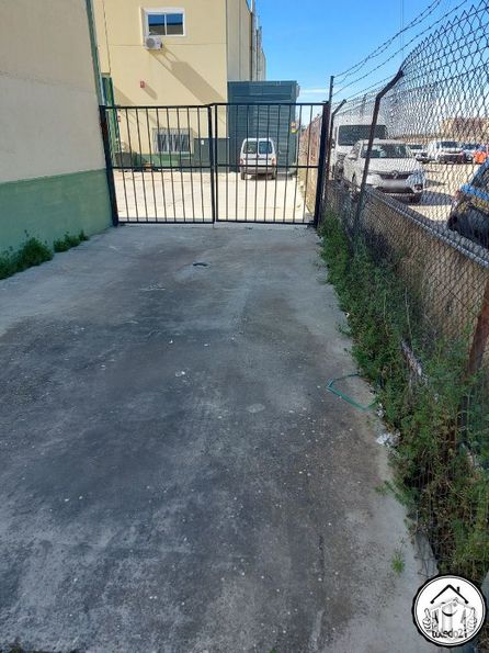 Industrial for sale at Camino Ciempozuelos, Seseña, Toledo, 45224 with clock, building, plant, road surface, fence, sky, asphalt, land lot, grass and public space around