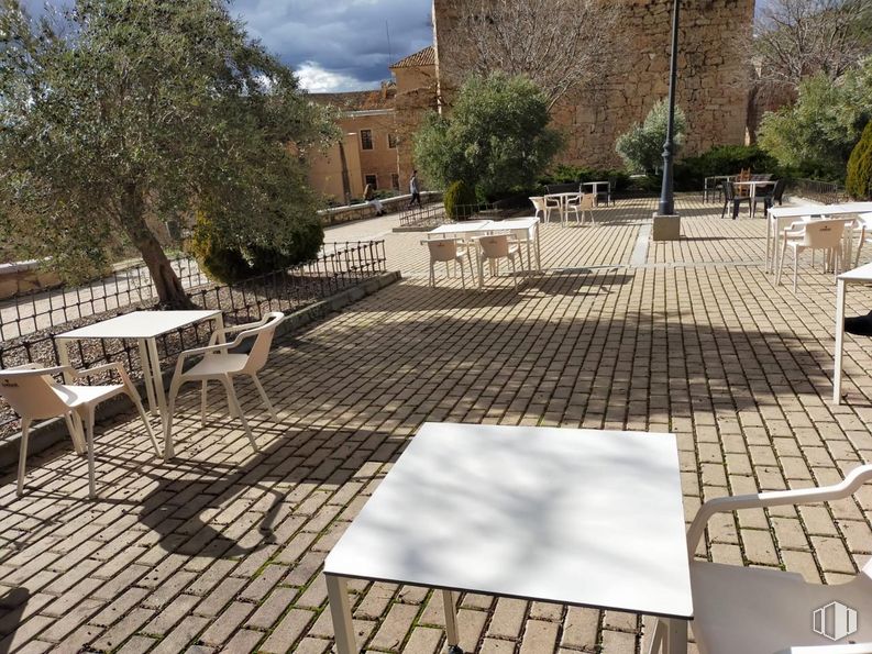 Retail for rent at Barrio del Castillo, Cuenca, 16001 with table, chair, road surface, sky, cloud, tree, flooring, urban design, wood and floor around