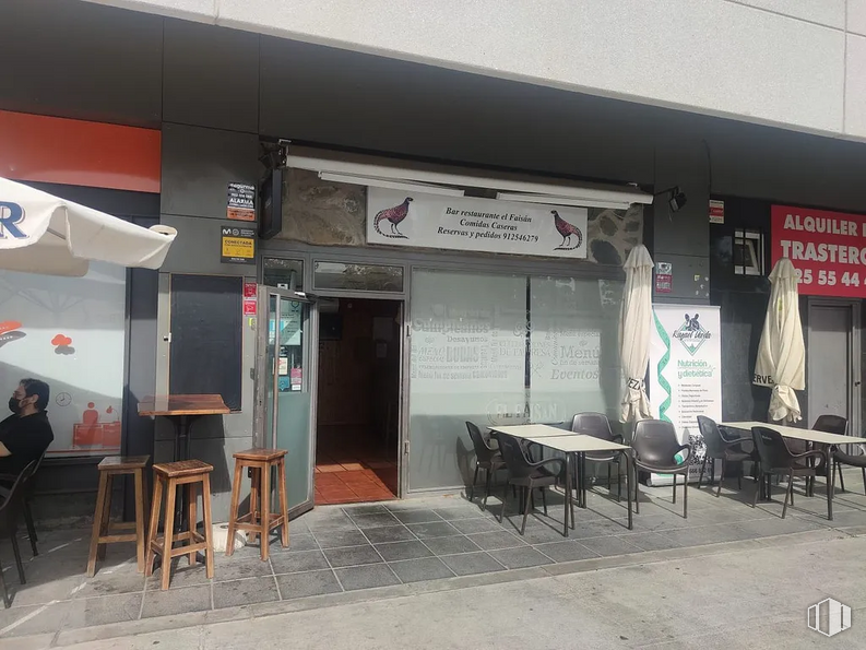 Retail for sale at Avenida Industria, Tres Cantos, Madrid, 28760 with stool, chair, person, table, furniture, public space, shade, real estate, door and building around