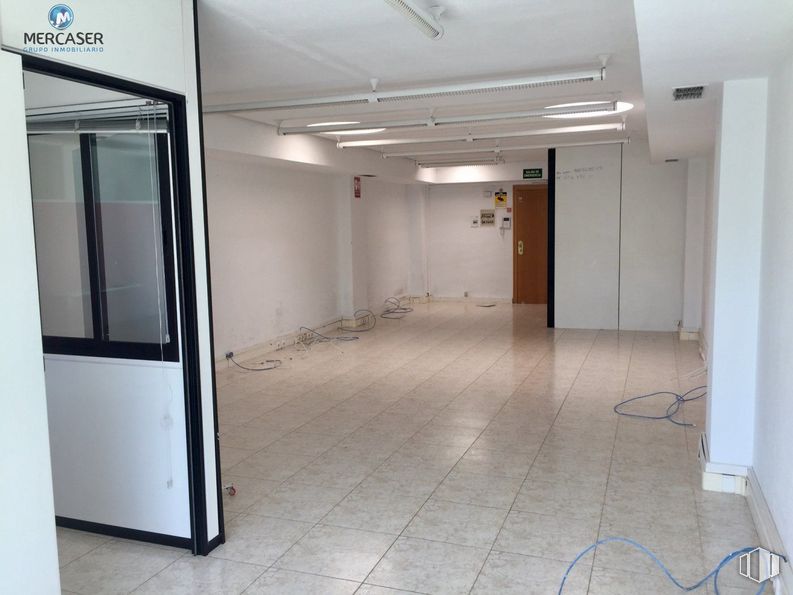 Office for rent at Vía Complutense, Alcalá de Henares, Madrid, 28805 with door, fixture, interior design, floor, flooring, glass, ceiling, vehicle door, building and automotive exterior around