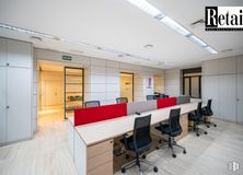 Office for rent at Calle Serrano, Salamanca, Madrid, 28001 with chair, desk, light fixture, lighting, door, table, furniture, property, office chair and building around