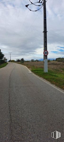 Land for sale at Camino Pajarillas, Móstoles, Madrid, 28935 with overhead power line, road surface, road, electricity, asphalt, thoroughfare, cloud, public utility, pole and lane around