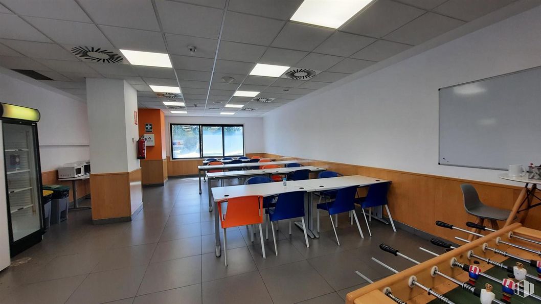 Office for rent at Zona Méndez Álvaro, Arganzuela, Madrid, 28045 with foosball table, chair, table, whiteboard, furniture, building, lighting, interior design, desk and flooring around