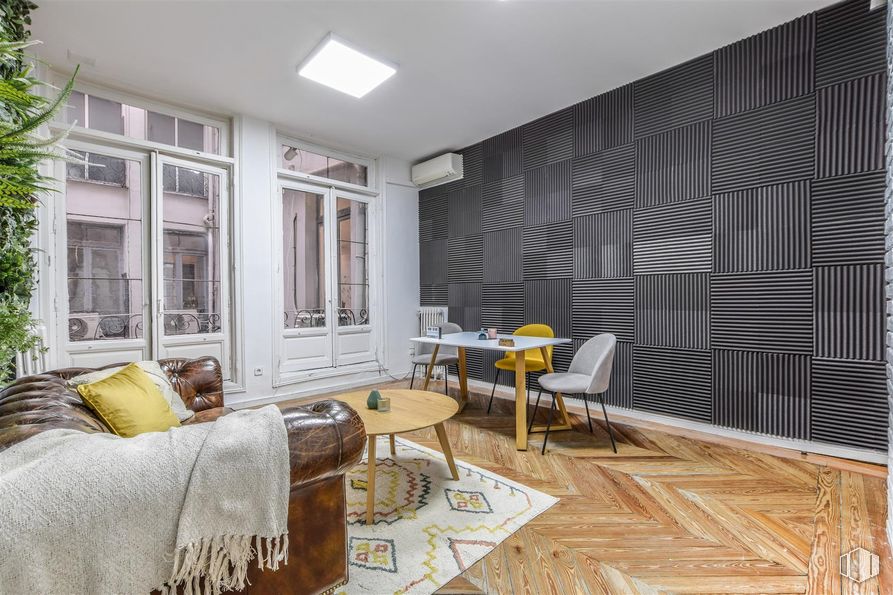 Office for rent at Calle Alfonso XII, 8, Retiro, Madrid, 28014 with chair, light fixture, table, couch, pillow, flooring, interior design, wall, floor and wood around