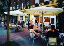 Retail for rent at Ronda Segovia, Arganzuela, Madrid, 28005 with chair, person, clothing, furniture, table, outdoor furniture, outdoor table, restaurant, sitting and shade around