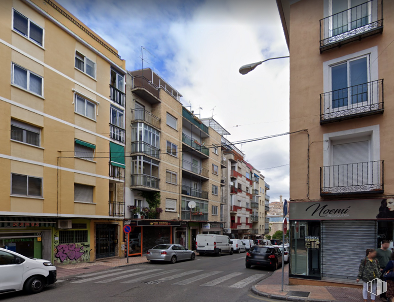 Retail for sale at Calle de Ramón y Cajal, Cuenca, 16004 with person, car, building, window, land vehicle, cloud, wheel, sky, vehicle and street light around