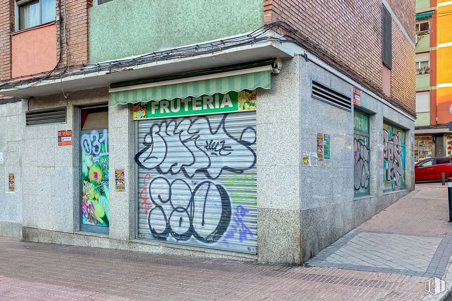 Retail for sale at Avenida Marqués de Corbera, Ciudad Lineal, Madrid, 28017 with window, building, fixture, paint, graffiti, road surface, art, neighbourhood, brickwork and font around