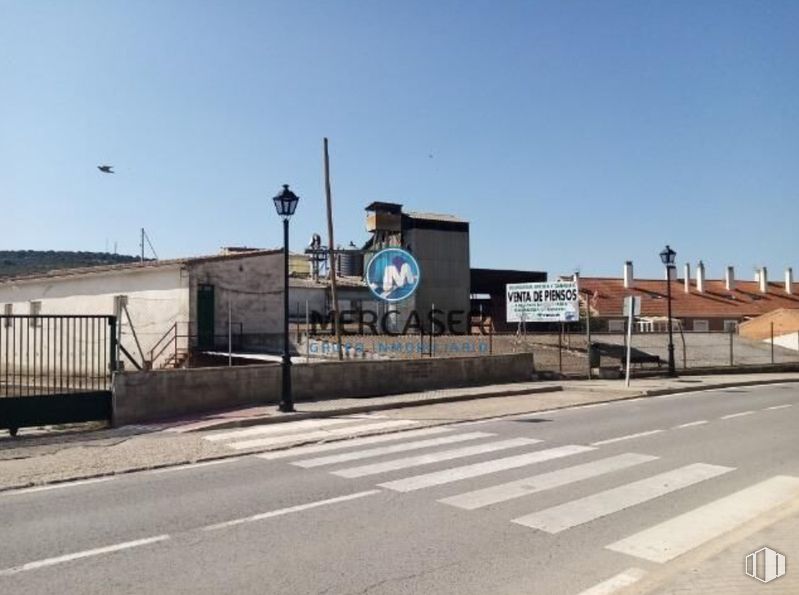 Industrial for sale at Paseo Estación, Tielmes, Madrid, 28550 with sky, fence, asphalt, street light, road surface, building, residential area, road, gas and city around