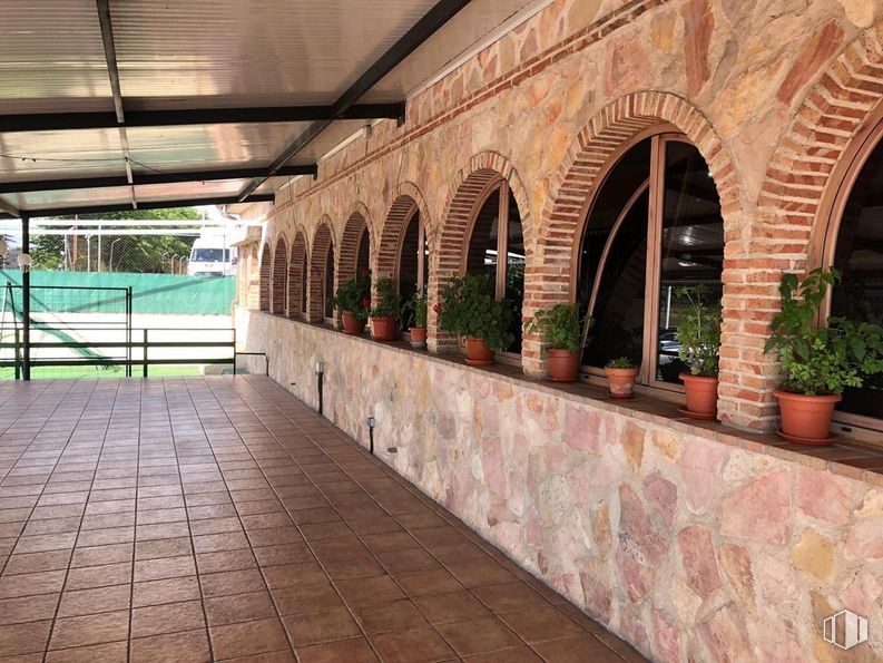 Industrial for sale at Carretera M-300, Torres de la Alameda, Madrid, 28813 with houseplant, plant, brickwork, brick, wall, flooring, facade, flowerpot, walkway and symmetry around