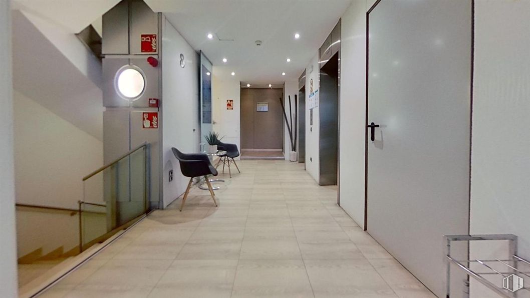 Office for rent at Paseo Castellana, Salamanca, Madrid, 28046 with chair, fixture, door, hall, floor, flooring, real estate, tile flooring, building and ceiling around