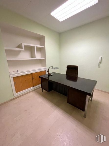 Office for rent at Zona centro, Cuenca, 16001 with cabinetry, desk, cupboard, table, furniture, property, building, wood, interior design and flooring around