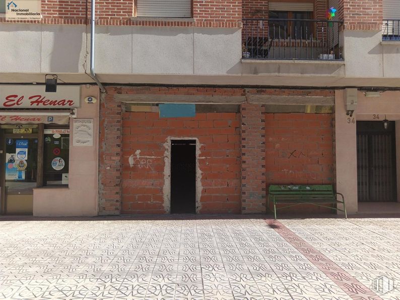 Retail for sale at Calle Camilo José Cela, Cuéllar, Segovia, 40200 with bench, door, window, wood, road surface, asphalt, city, brick, facade and flooring around