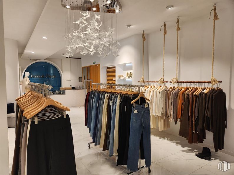 Retail for sale at Zona centro, Villanueva de la Cañada, Madrid, 28691 with lighting, chandelier, pants, clothing, jeans, interior design, flooring, retail, boutique and ceiling around