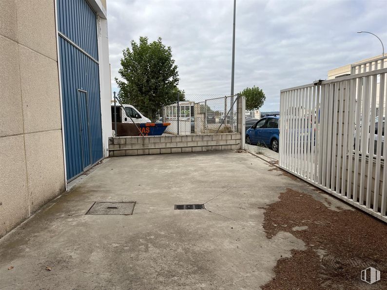 Industrial for sale at Camino Carrera, Fuente el Saz de Jarama, Madrid, 28140 with car, tire, wheel, cloud, sky, automotive tire, tree, road surface, fence and vehicle around