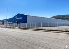 Industrial for sale & for rent at Zona Miguel Servet, Alcalá de Henares, Madrid, 28802 with building, sky, slope, asphalt, road surface, fence, landscape, road, tar and composite material around