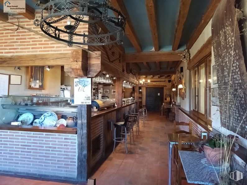 Retail for sale at Zona Collado Hermoso, Collado Hermoso, Segovia, 40170 with lighting, chandelier, light fixture, table, wood, building, interior design, beam, hardwood and chair around