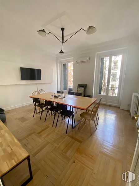 Office for rent at Calle Ferraz, Moncloa - Aravaca, Madrid, 28008 with chair, kitchen & dining room table, lighting, television, light fixture, table, chandelier, furniture, flooring and floor around