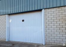 Industrial for sale at Calle León, Magán, Toledo, 45590 with wall, wood, garage door, composite material, siding, concrete, garage, grey, building material and driveway around