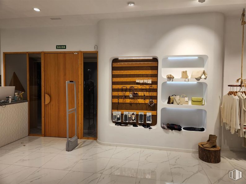 Retail for sale at Zona centro, Villanueva de la Cañada, Madrid, 28691 with furniture, door, clothing, wall, interior design, flooring, wood, shelving, shelf and floor around