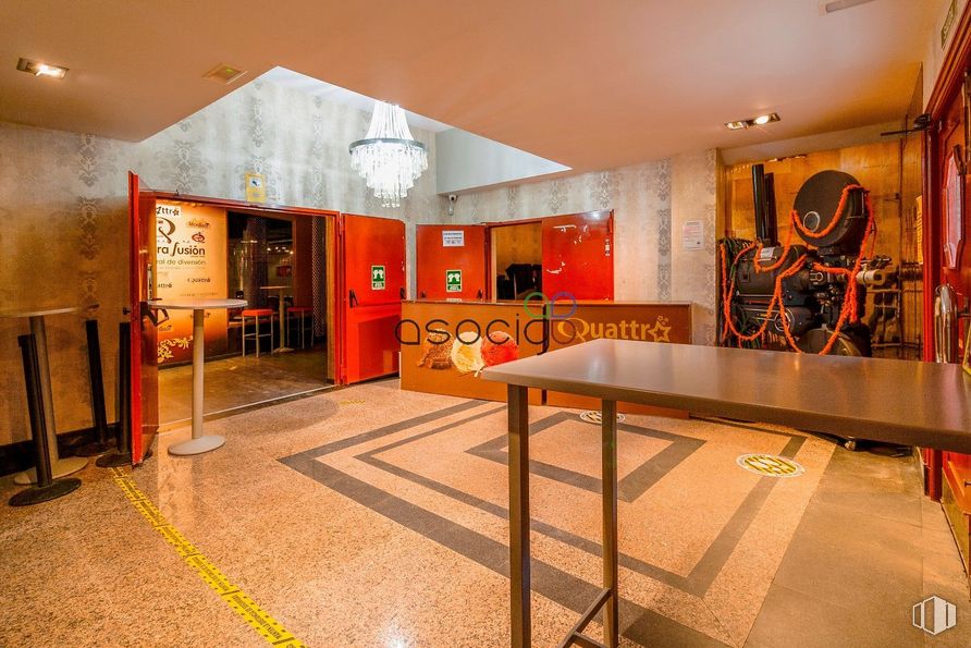 Retail for sale at Calle Real, Yunquera de Henares, Guadalajara, 19210 with lighting, light fixture, desk, table, furniture, interior design, orange, architecture, hall and flooring around