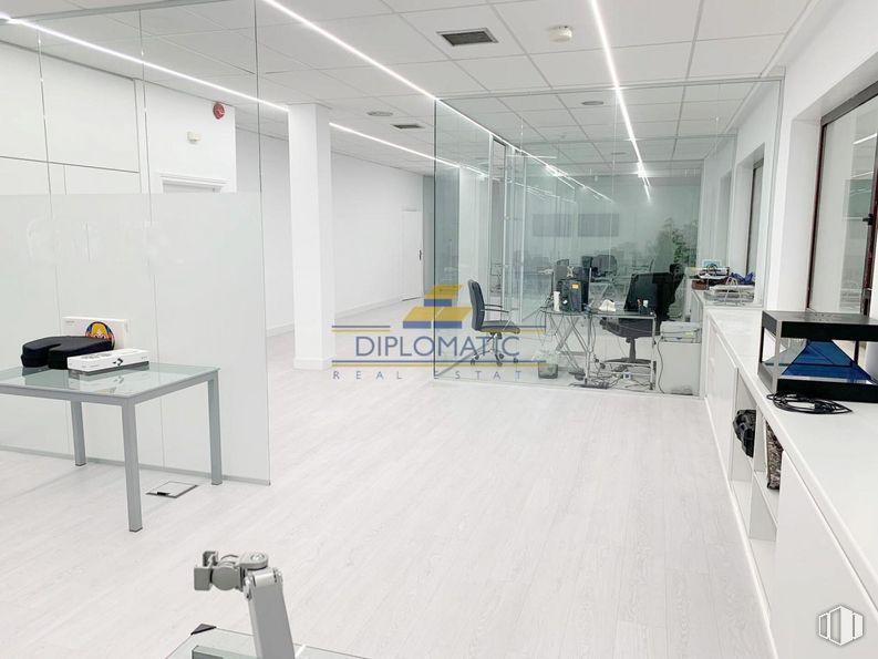 Office for sale & for rent at Zona Las Matas, Las Rozas de Madrid, Madrid, 28290 with table, tap, chair, building, interior design, flooring, floor, automotive design, hall and glass around