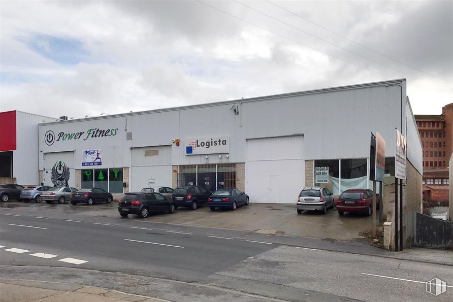 Industrial for sale at Polígono El Cerro, Segovia, 40006 with building, car, automotive parking light, wheel, tire, sky, cloud, property, vehicle and automotive tire around