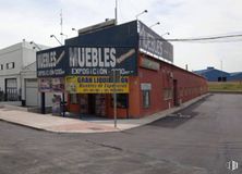 Industrial for sale at Polígono industrial El Palomo, Fuenlabrada, Madrid, 28946 with building, sky, window, asphalt, facade, city, cloud, road, door and road surface around