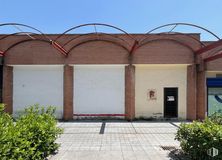 Retail for rent at Avenida Viñuelas, 17, Tres Cantos, Madrid, 28760 with door, plant, daytime, property, sky, shade, brickwork, architecture, brick and road surface around